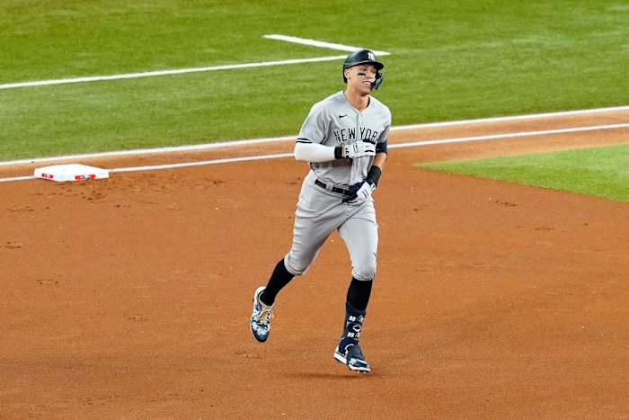 New York Yankees’ Aaron Judge rounds the bases after hitting a solo home run, his 62nd of the season, in the first inning of the second baseball game of a doubleheader against the Texas Rangers in Arlington, Texas, Tuesday, Oct. 4, 2022. With the home run, Judge set the AL record for home runs in a season, passing Roger Maris.